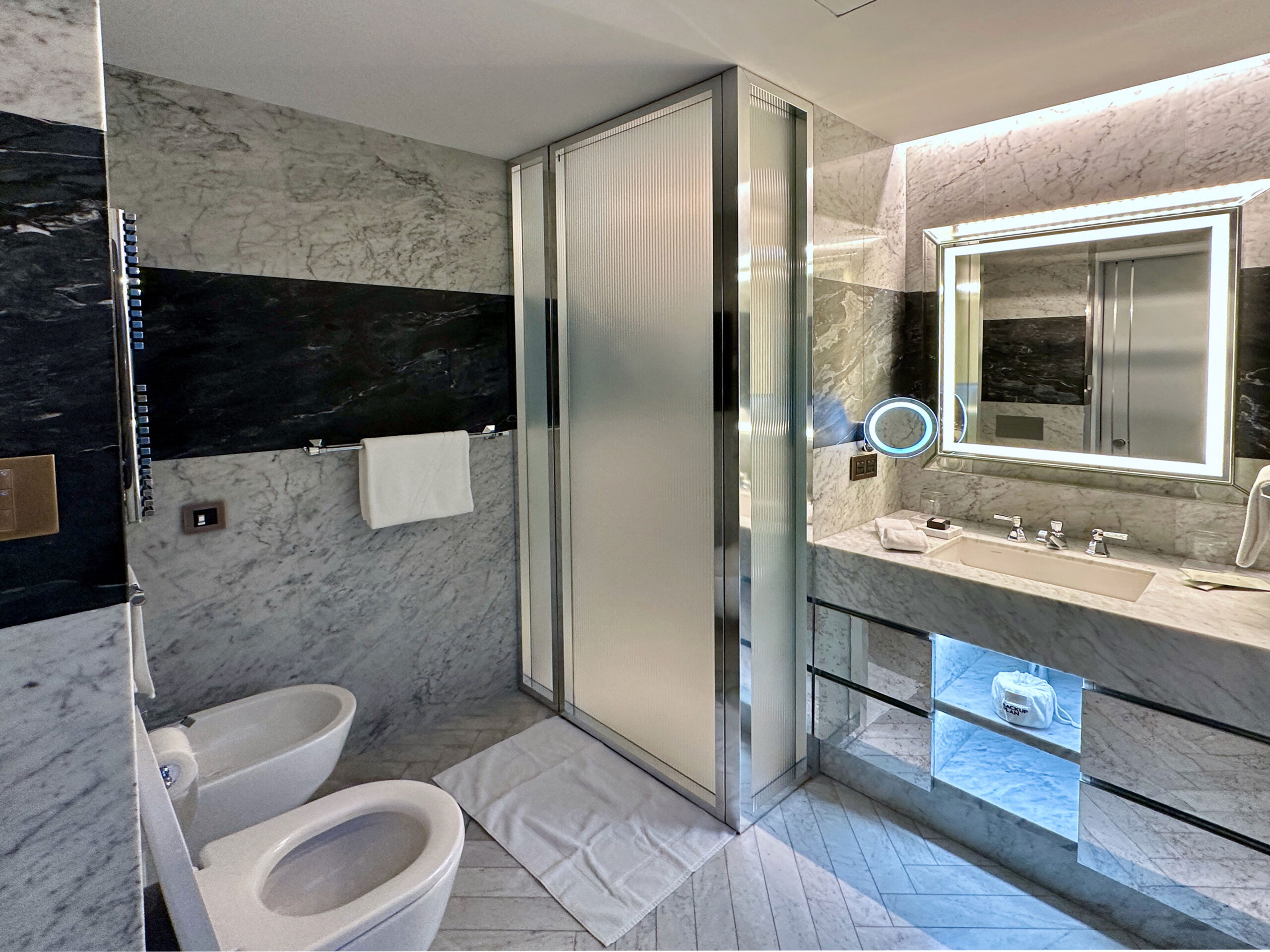 Modern bathroom at W Rome hotel with Dyson hairdryer and luxury amenities