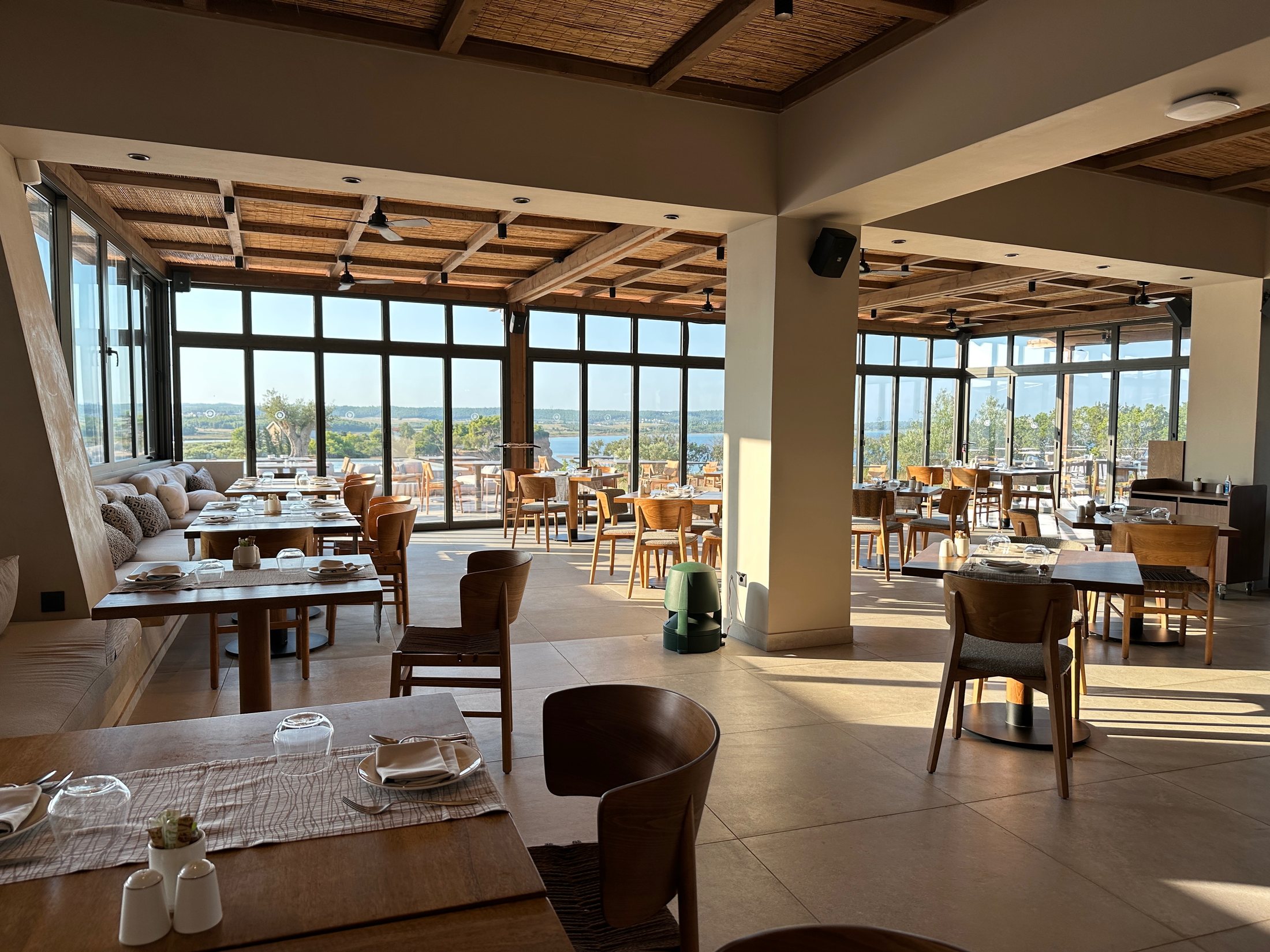 Mesogeia restaurant with panoramic windows at Zelia Halkidiki
