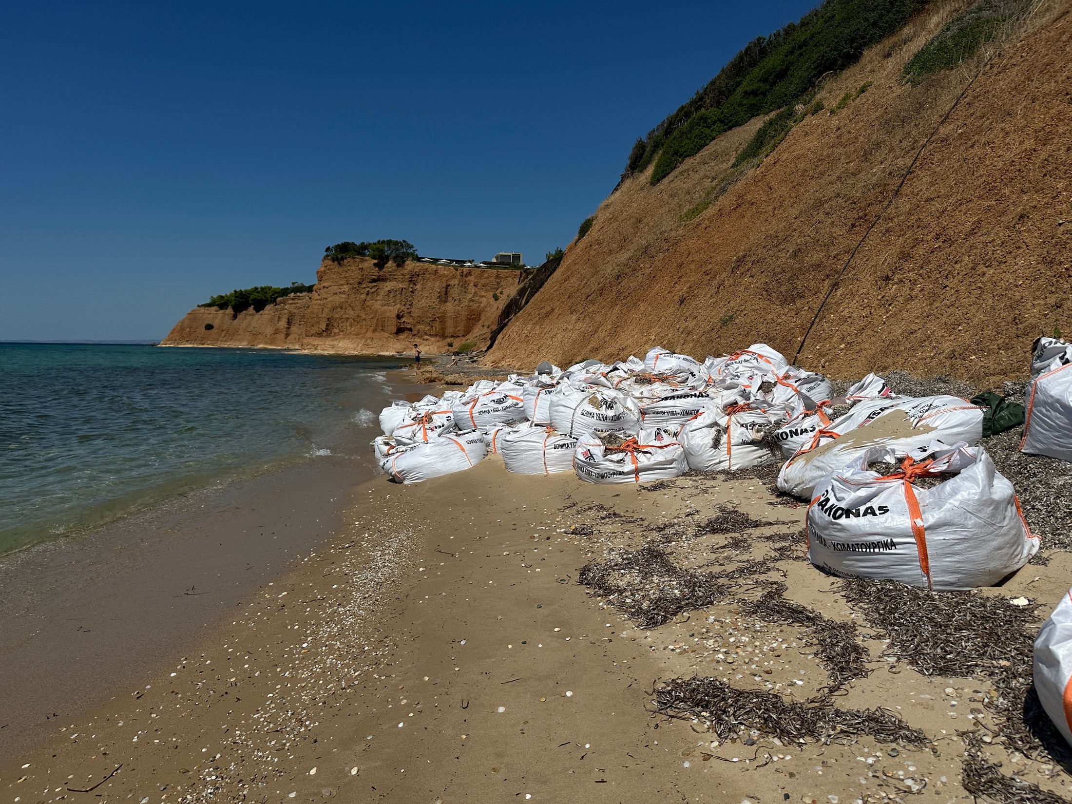 Beach area with seaweed bags near Zelia Halkidiki